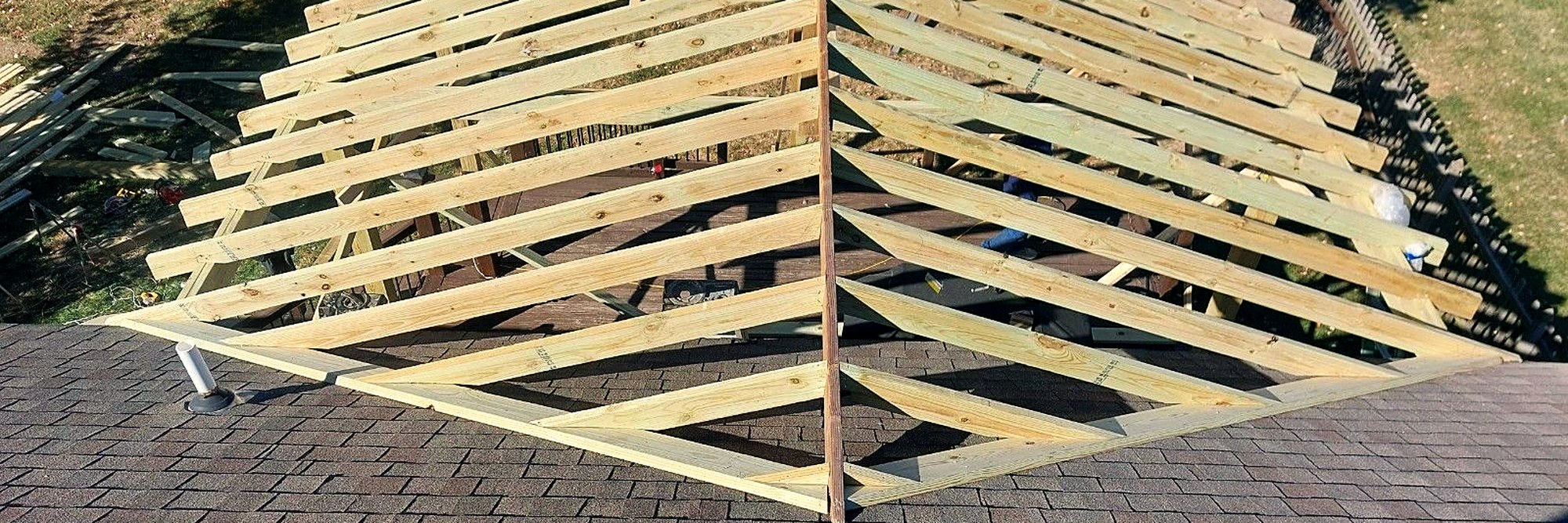 Roof framing seen from above, looking down the rafters.